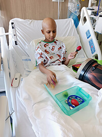 A child in a hospital bed.