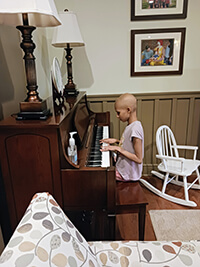 A child playing a piano.