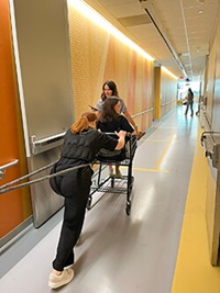 Medical professionals walking down a hallway.