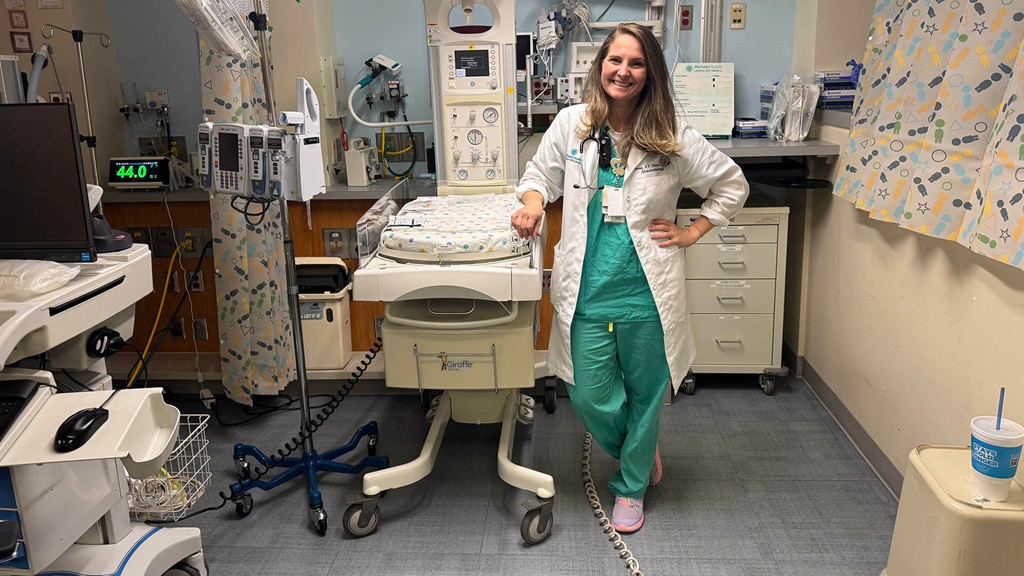 A medical professional standing next to medical equipment.