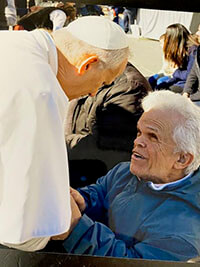 A man meeting the Pope.