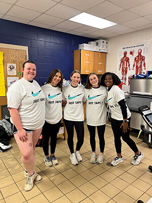 A group of people smiling at the camera.