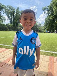 A child smiling at the camera.