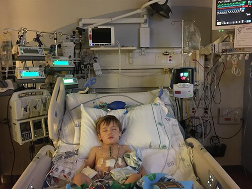 A child in a hospital bed.