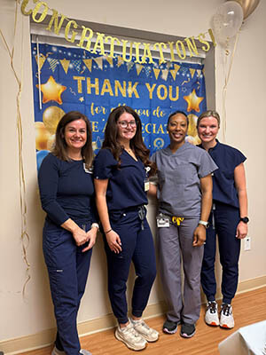 A group of people smiling at the camera.