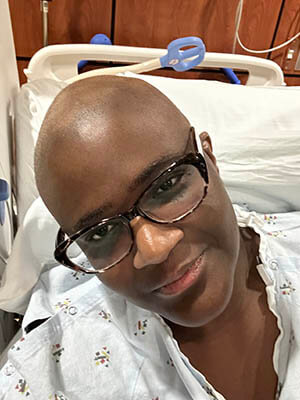 A woman smiling at the camera.