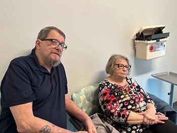 A couple in a medical room.