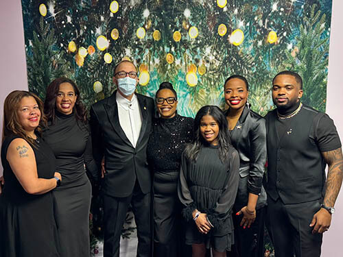 A group of people smiling at the camera.