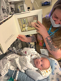 A baby in a hospital bed.