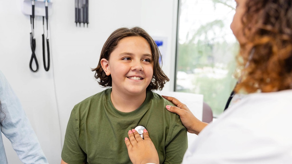 A doctor treating a young patient.