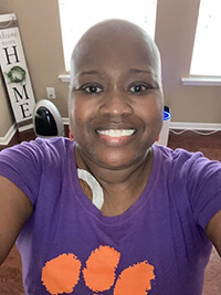 A woman smiling at the camera.