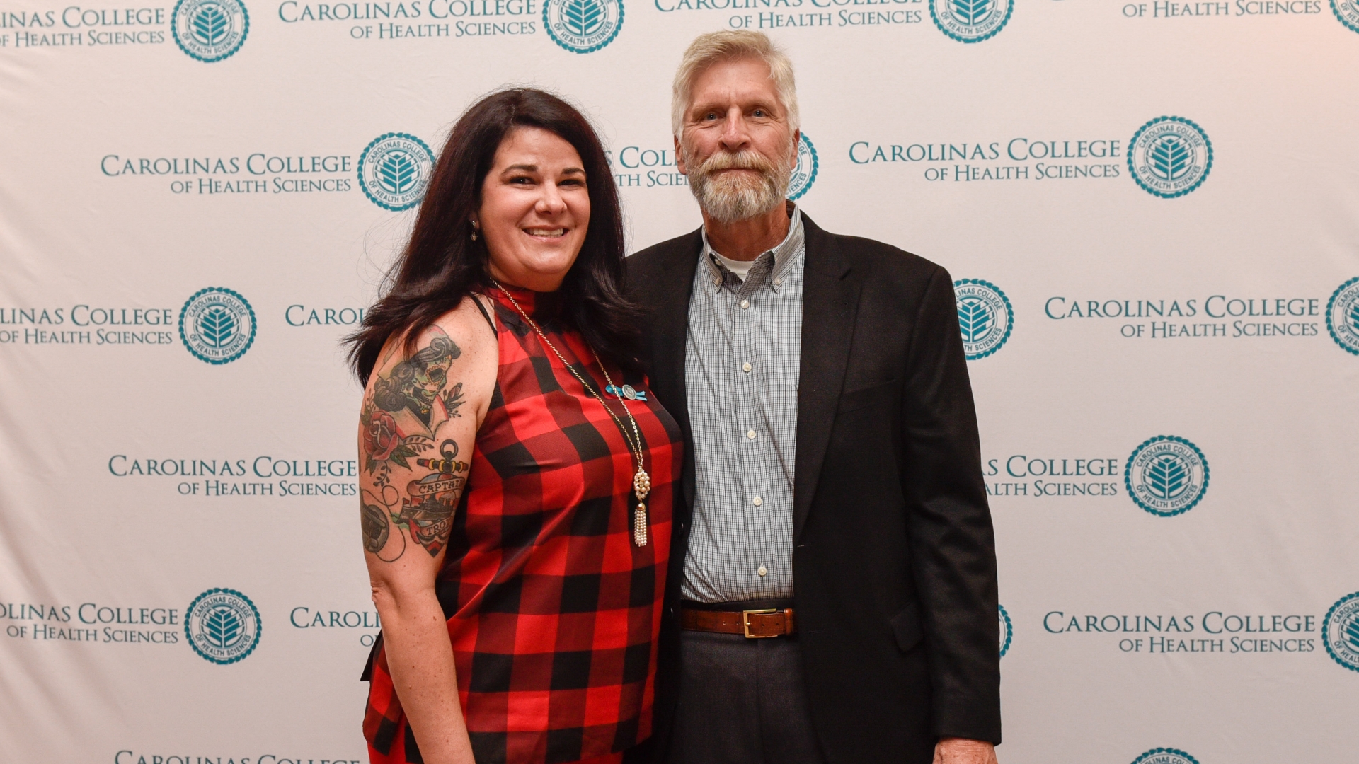 Dick Winters, a cardiac arrest patient, poses with Julia Rouse, a nursing student from Carolinas College of Health Sciences who saved his life. 