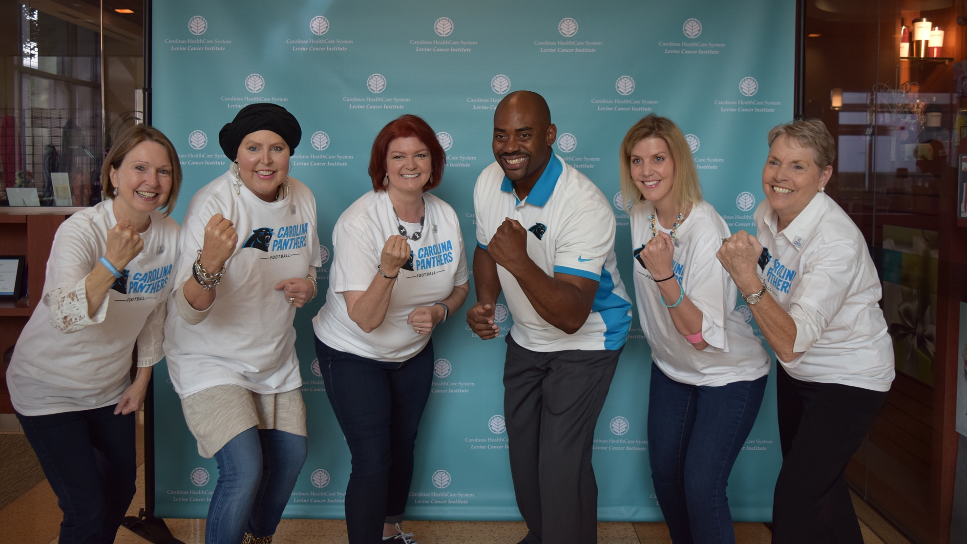 Former Carolina Panthers linebacker Chris Draft (third from right), met with lung cancer survivors at Levine Cancer Institute in Charlotte, N.C., as part of a vow he made to his late wife to support other survivors. 