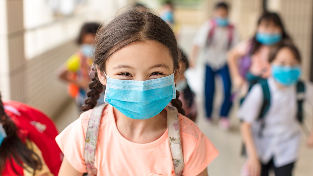 As COVID-19 cases rise in children, a pediatric infectious disease expert offers advice on helping kids return to school safely
