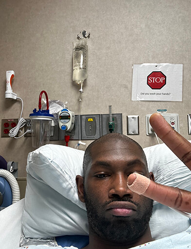 Darryl Bigelow resting in a hospital bed.