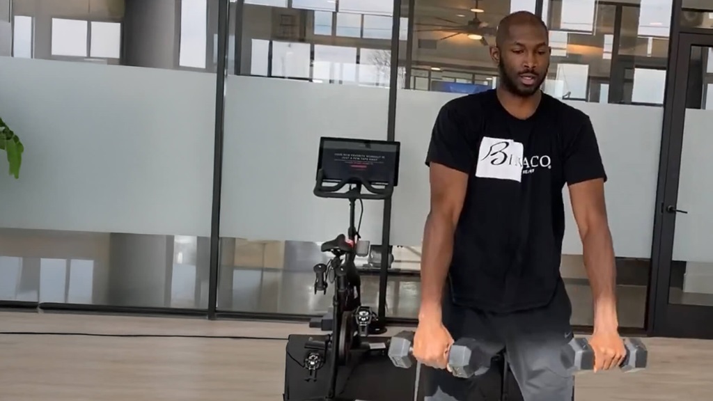 Darryl Bigelow exercising at a gym.