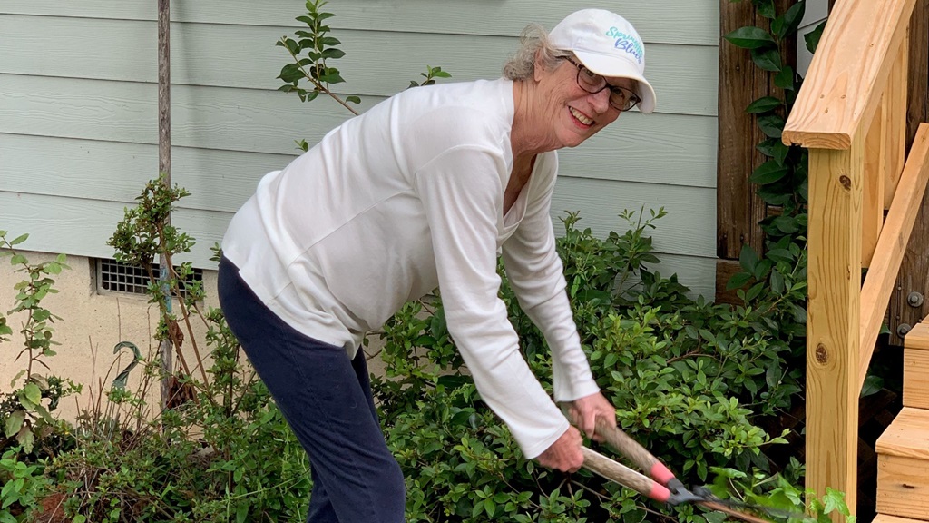 Becky Palmer working in her yard