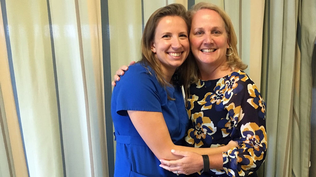 Sarah Sadler (Fruendt), left, once a patient at Levine Children’s Hospital, is now a nurse in the same unit where she was treated, and even works alongside some of the same nurses -- including Kathy Martin, at right -- who provided care for her.  