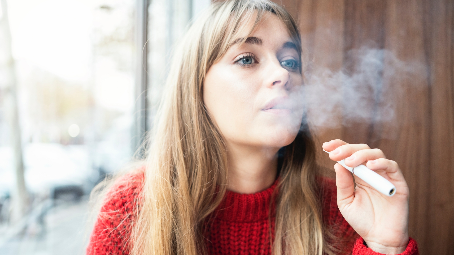 Teenager girl smoking e-cigarette