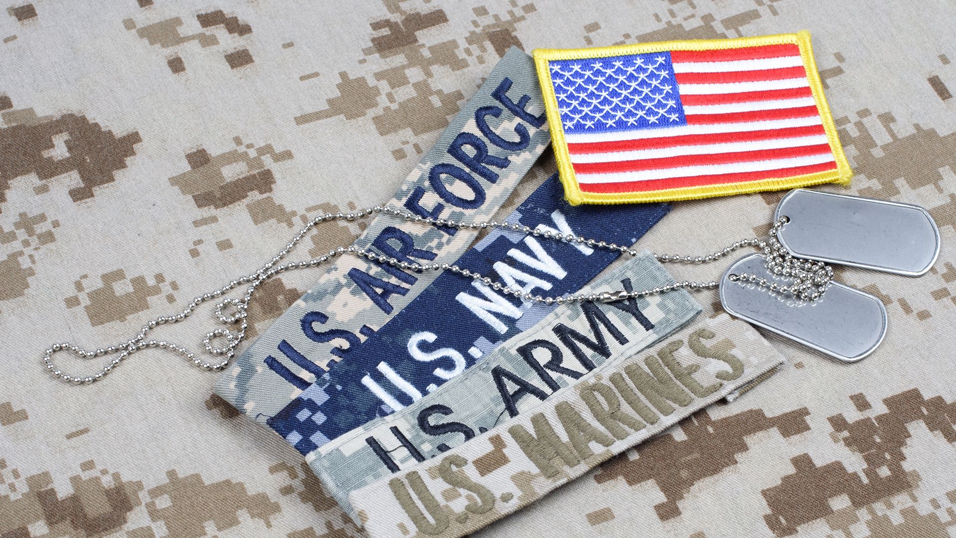 U.S. Air Force, U.S. Navy, U.S. Army and U.S. Marines veteran metal tags with American Flag.