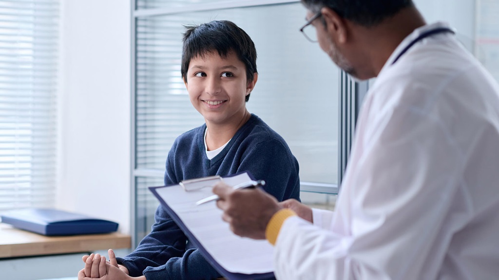 Teen talking to male doctor