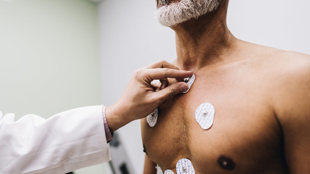 Man with EKG stickers on his chest