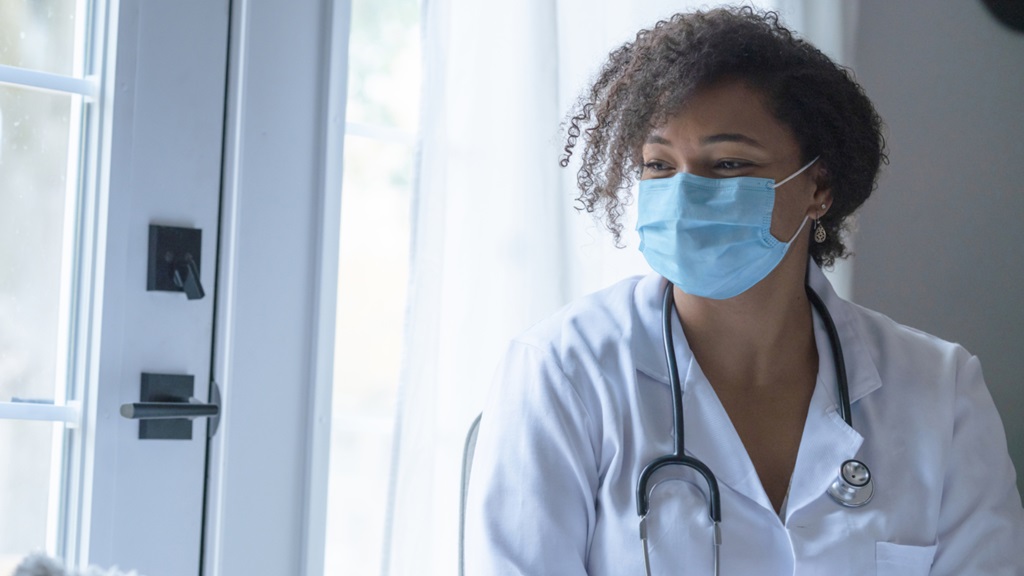 Doctor in a lab coat and Mask