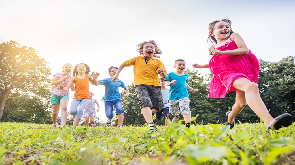 kids playing around in the grass