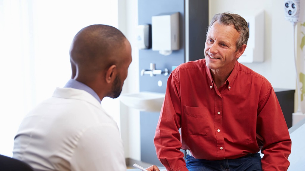 Doctor talking to man 