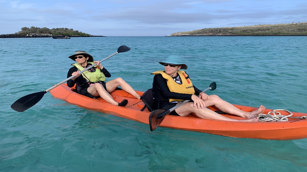 Two women in the water kyaking 