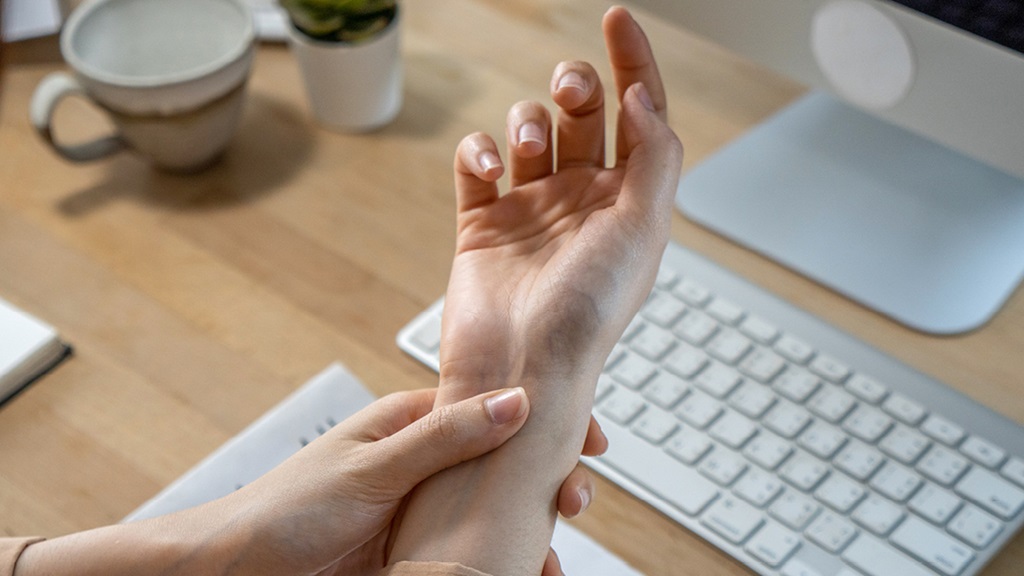 Woman clenching hand 