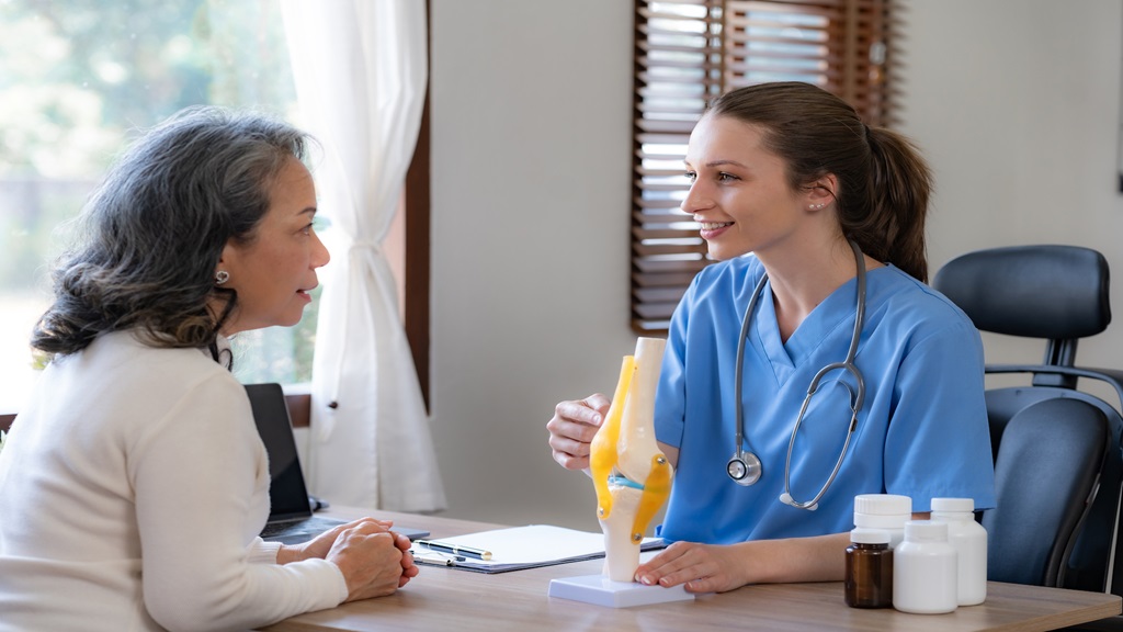 Physician talking to patient