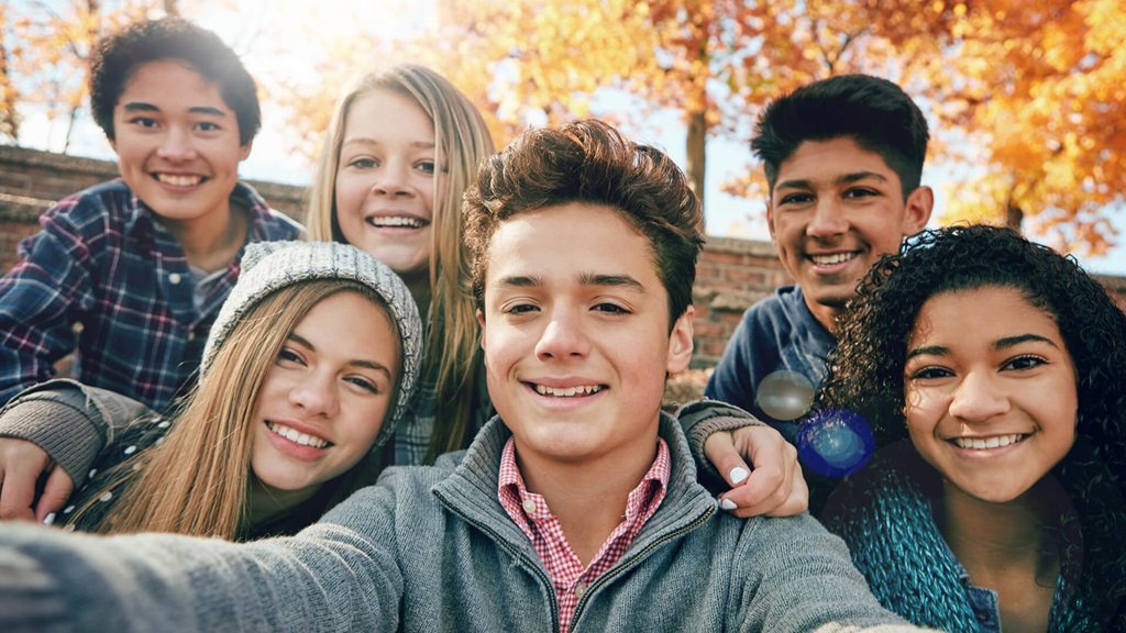 Teens gathered around