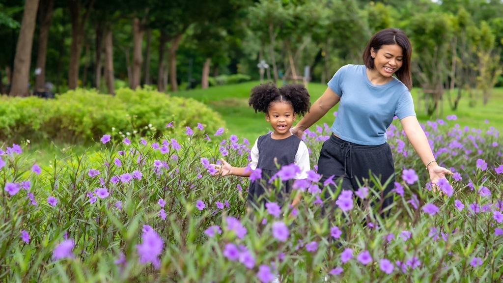 Woman and child in flower field 