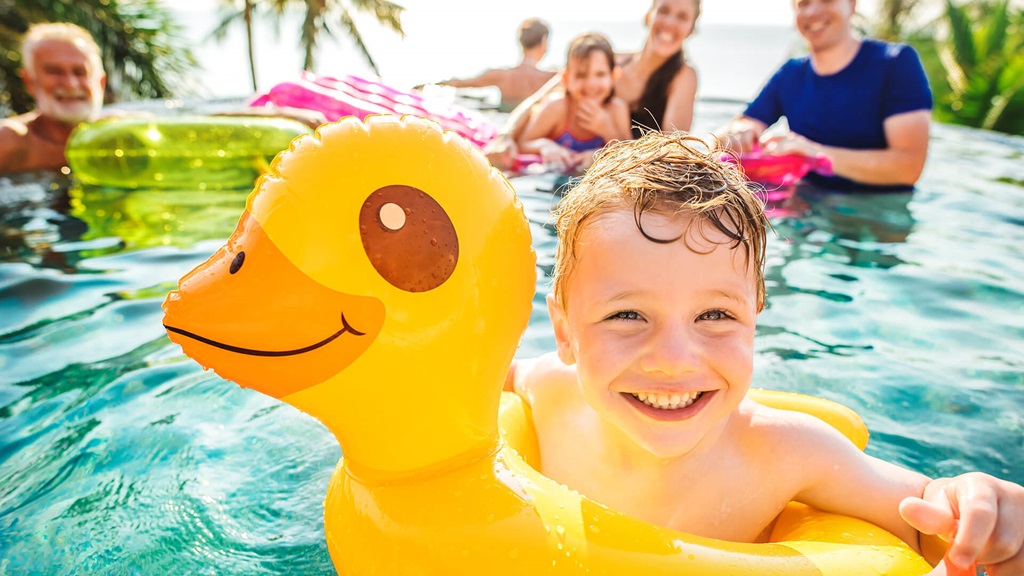 Child in a duckie floatie in the pool
