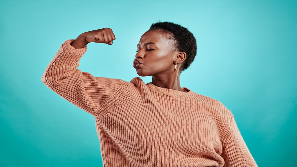 Black woman flexing her arm