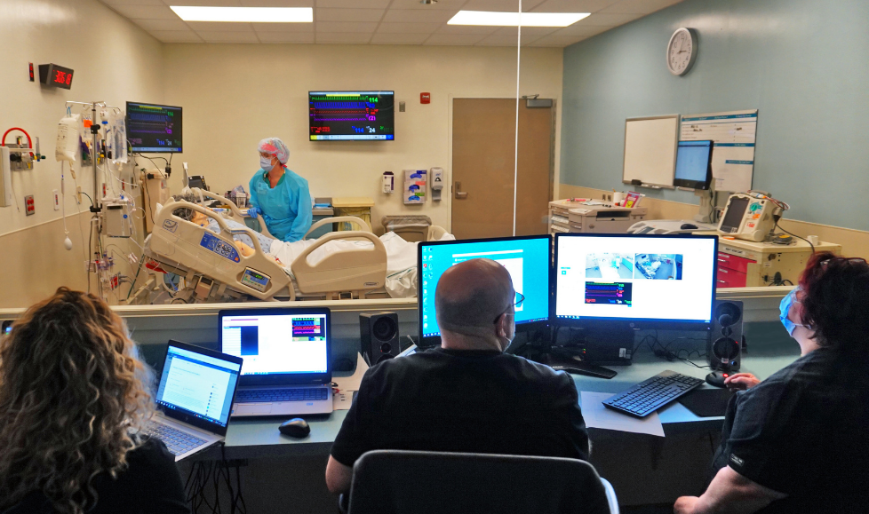 Simulation staff look on during an exercise
