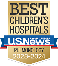 A gold badge with a red and blue ribbon holding the U.S. News and World Report logo recognizing best children's hospitals for pulmonology.