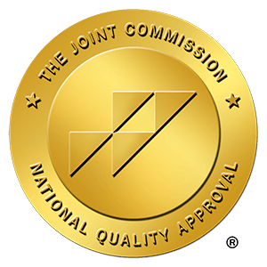 A gold badge recognizing accreditation by the Joint Commission.